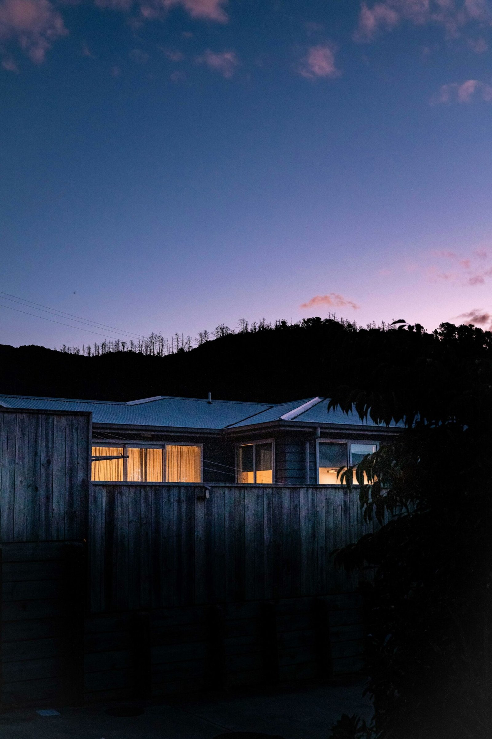 Modern house with warm lights at dusk