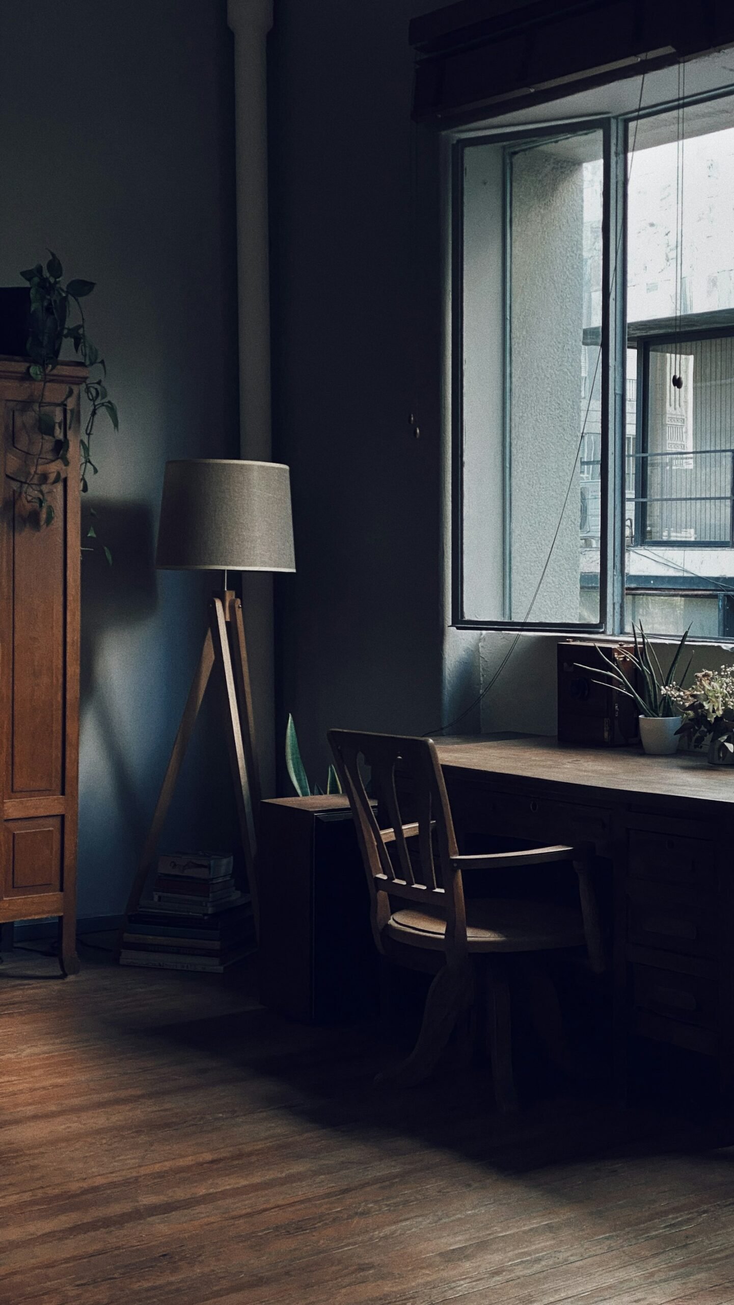 Desk, lamp and window in the studio